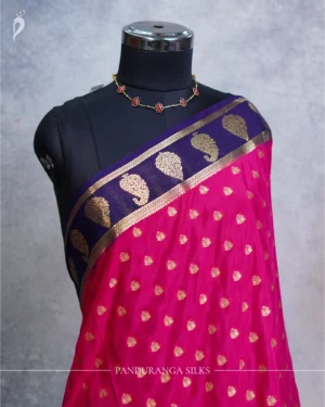 Rani Pink Mysore Crepe Silk Saree with Golden Zari Buttas Rani pink Mysore Crepe silk saree with golden zari buttas and royal blue zari border