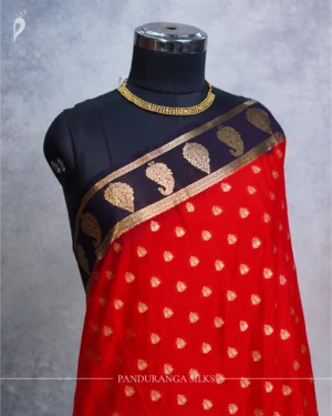 Red Mysore Crepe Silk Saree with Rich Golden Zari Butta Work Red Mysore Crepe silk saree with golden zari buttas and deep purple floral zari border