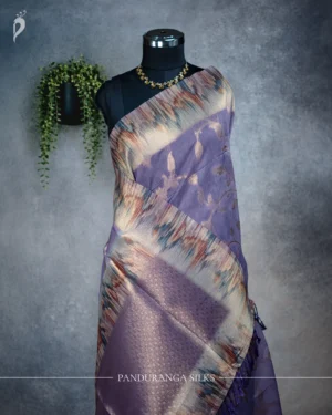 Dusty lavender tissue silk saree with antique gold floral weave and multicolour artistic border