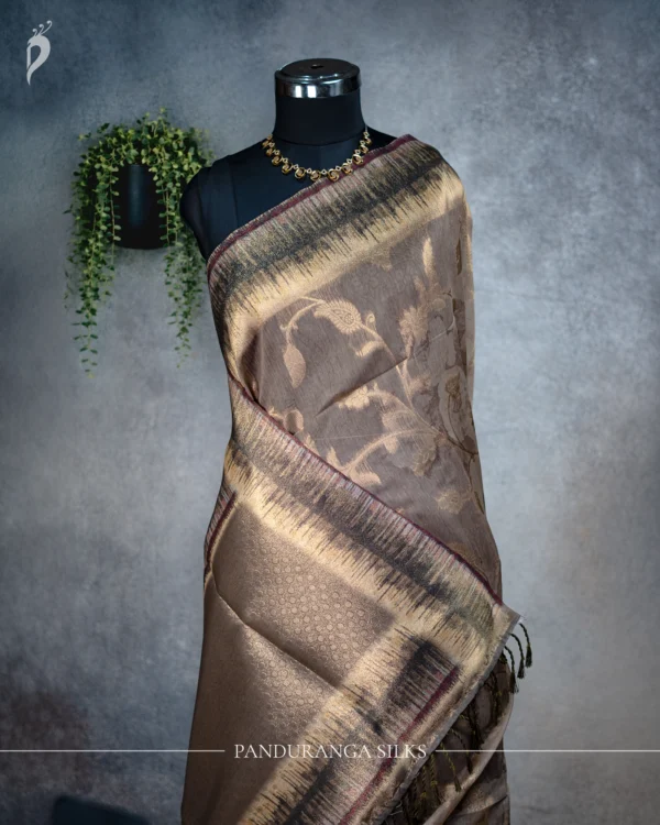 Mushroom Beige Tissue Silk Saree with Antique Gold Woven Border Mushroom beige tissue silk saree with antique gold floral weave and artistic multicolour border