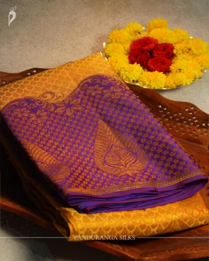 Mustard Yellow Royal Blue Purple Handloom Silk Saree with Zari Border Mustard yellow handloom silk saree with royal blue-purple floral zari border, paisley pallu and matching blouse