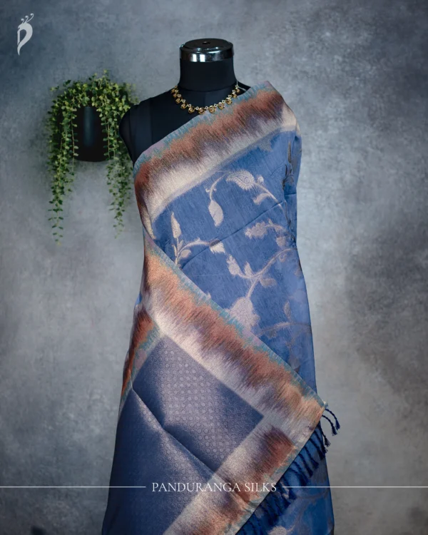 Steel Blue Tissue Silk Saree with Silver Floral Woven Border Steel blue tissue silk saree with silver floral weave and multicolour metallic border