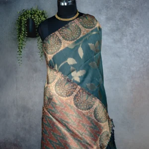 Dusty teal blue tissue silk saree with antique gold floral motifs, peacock border and multicolour pallu