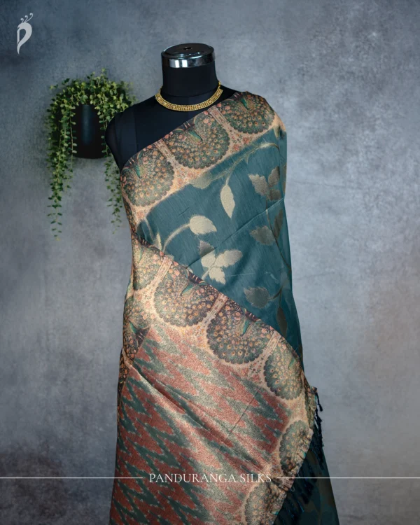 Dusty Teal Blue Tissue Silk Saree with Antique Gold Floral Weave Dusty teal blue tissue silk saree with antique gold floral motifs, peacock border and multicolour pallu