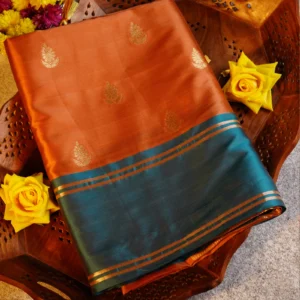 Peach pink Gadwal silk saree with gold zari buttas, turquoise blue gap border and geometric zari pallu