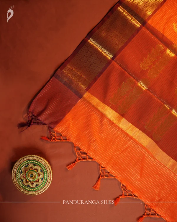 Orange Silk Saree with Zari Checks and Golden Pineapple Buttas Orange silk saree with golden zari checks, pineapple motifs and woven zari border