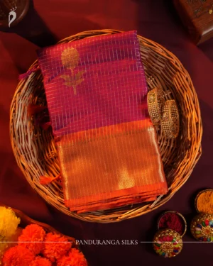 Plum Purple Silk Saree with Zari Checks and Golden Pineapple Buttas Plum purple silk saree with copper zari checks, golden pineapple motifs and geometric zari border