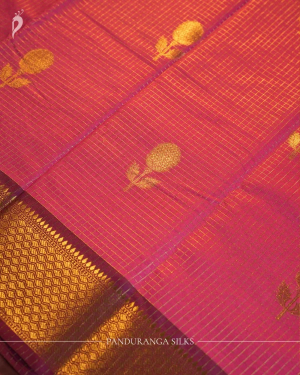 Plum Purple Silk Saree with Zari Checks and Golden Pineapple Buttas Plum purple silk saree with copper zari checks, golden pineapple motifs and geometric zari border