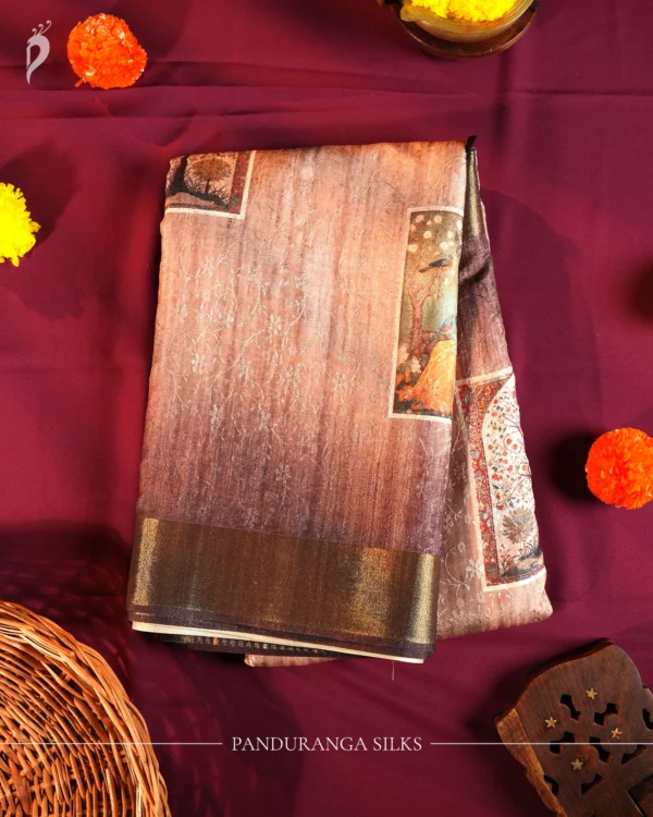Muted rose pink art silk saree with Mughal inspired floral print, embossed work and subtle zari border