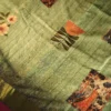 Pistachio Green Silk Saree with Mughal Inspired Floral Emboss Work Pistachio green silk saree with Mughal-inspired printed panels, floral emboss work and subtle zari border