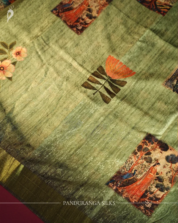 Pistachio Green Silk Saree with Mughal Inspired Floral Emboss Work Pistachio green silk saree with Mughal-inspired printed panels, floral emboss work and subtle zari border