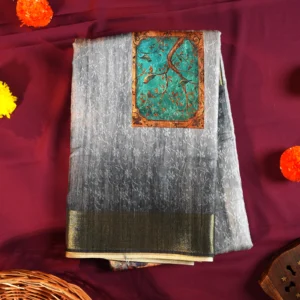 Powder blue silk saree with Mughal-inspired printed panels, floral emboss work and subtle zari border