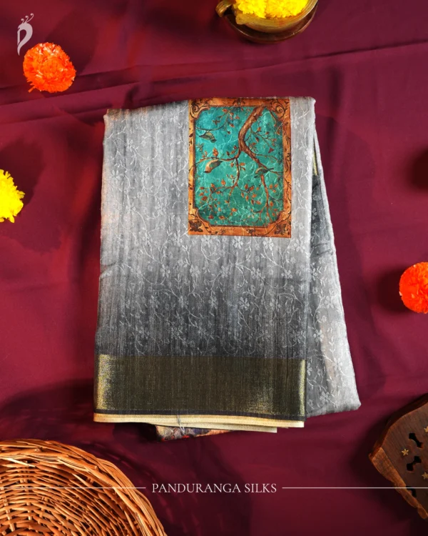 Powder Blue Silk Saree with Mughal Inspired Floral Emboss Work Powder blue silk saree with Mughal-inspired printed panels, floral emboss work and subtle zari border