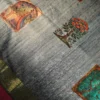 Powder Blue Silk Saree with Mughal Inspired Floral Emboss Work Powder blue silk saree with Mughal-inspired printed panels, floral emboss work and subtle zari border