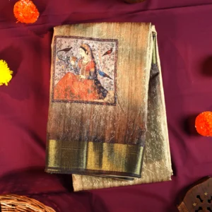 Sage green silk saree with Mughal-inspired printed panels, floral emboss work and zari border