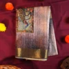 Lavender Grey Silk Saree with Mughal Art and Floral Emboss Work Lavender grey silk saree with Mughal-inspired peacock panels, floral emboss work and zari border