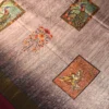 Lavender Grey Silk Saree with Mughal Art and Floral Emboss Work Lavender grey silk saree with Mughal-inspired peacock panels, floral emboss work and zari border