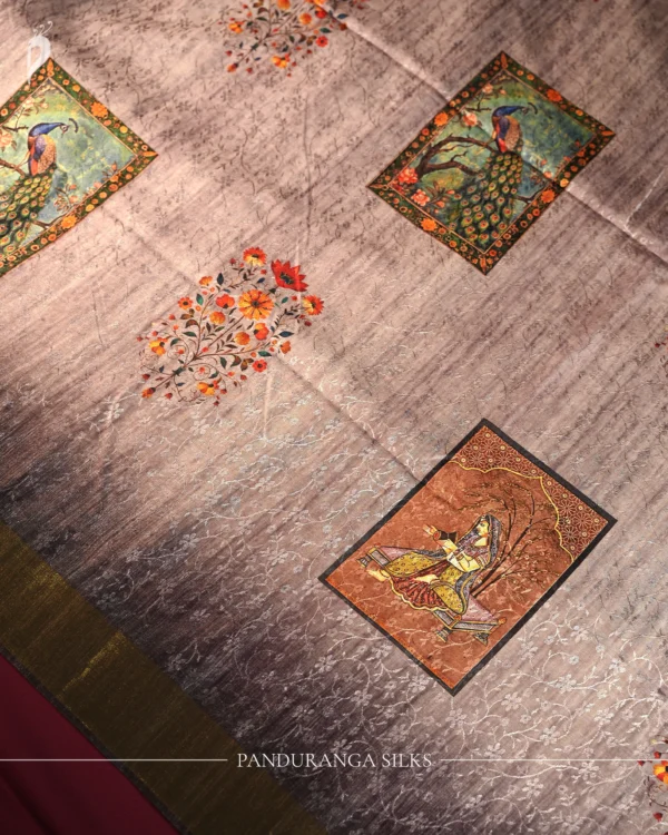 Lavender Grey Silk Saree with Mughal Art and Floral Emboss Work Lavender grey silk saree with Mughal-inspired peacock panels, floral emboss work and zari border