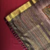 Lavender Grey Silk Saree with Mughal Art and Floral Emboss Work Lavender grey silk saree with Mughal-inspired peacock panels, floral emboss work and zari border