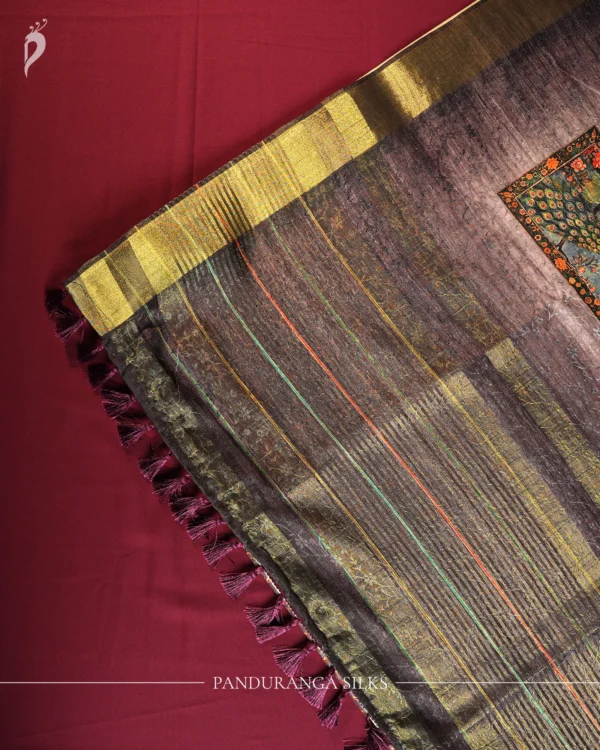 Lavender Grey Silk Saree with Mughal Art and Floral Emboss Work Lavender grey silk saree with Mughal-inspired peacock panels, floral emboss work and zari border