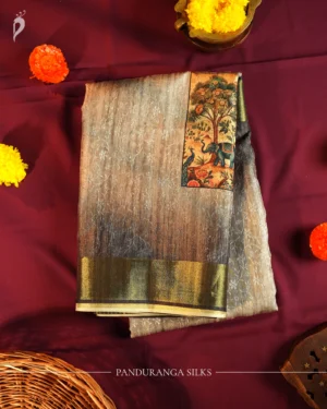 Steel Grey Silk Saree with Mughal Art and Floral Emboss Work Steel grey silk saree with Mughal-inspired elephant art, floral emboss work and subtle zari border