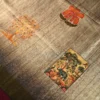 Steel grey silk saree with Mughal-inspired elephant art, floral emboss work and subtle zari border