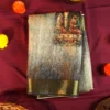Charcoal Grey Silk Saree with Mughal Prints and Floral Emboss Work Charcoal grey silk saree with Mughal-inspired art, floral emboss work, multicolour panels and zari border