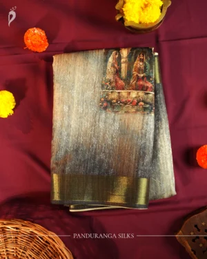 Charcoal grey silk saree with Mughal-inspired art, floral emboss work, multicolour panels and zari border