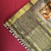 Charcoal Grey Silk Saree with Mughal Prints and Floral Emboss Work Charcoal grey silk saree with Mughal-inspired art, floral emboss work, multicolour panels and zari border