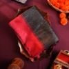 Charcoal Black Raw Silk Saree with Checked Design and Maroon Border Charcoal black raw silk saree with zari checks, maroon temple-work border, contrast pallu and tassels