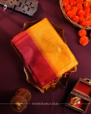 Mustard yellow raw silk saree with zari checks, wine maroon temple border and contrasting zari-woven pallu