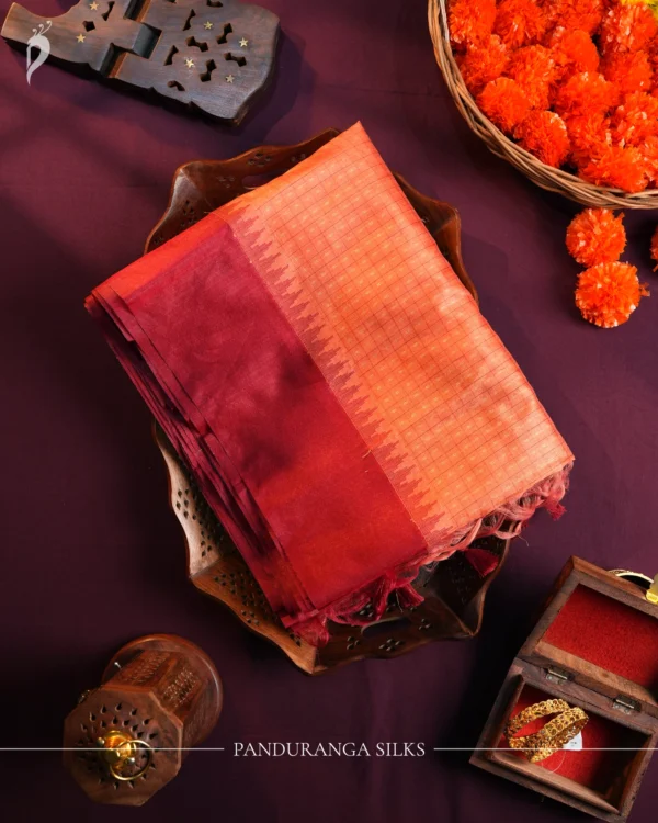 Coral Orange Raw Silk Saree with Checks and Deep Maroon Border Coral orange raw silk saree with zari checks, deep maroon temple border and contrasting zari-woven pallu