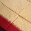 Ivory Raw Silk Saree with Checks and Deep Maroon Temple Border Ivory raw silk saree with zari checks, deep maroon temple border, contrasting pallu and tassel detailing