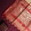 Ivory Raw Silk Saree with Checks and Deep Maroon Temple Border Ivory raw silk saree with zari checks, deep maroon temple border, contrasting pallu and tassel detailing