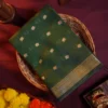 Green Soft Silk Cotton Saree with Traditional Golden Zari Buttas Green silk cotton saree with golden zari buttas and a traditional design