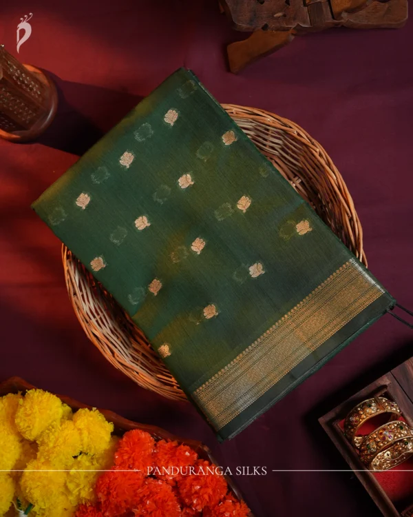 Green Soft Silk Cotton Saree with Traditional Golden Zari Buttas Green silk cotton saree with golden zari buttas and a traditional design