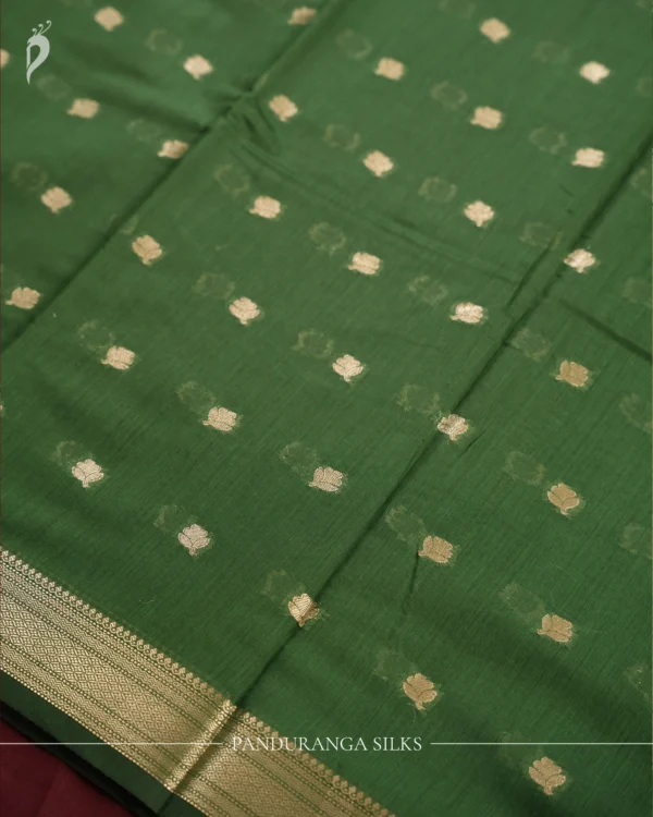 Green Soft Silk Cotton Saree with Traditional Golden Zari Buttas Green silk cotton saree with golden zari buttas and a traditional design