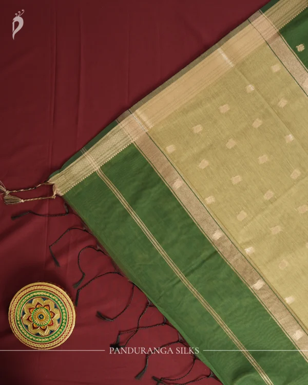Green Soft Silk Cotton Saree with Traditional Golden Zari Buttas Green silk cotton saree with golden zari buttas and a traditional design