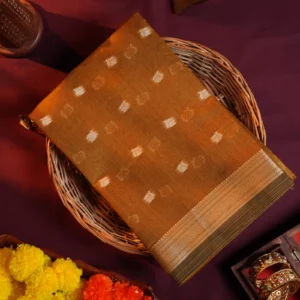 Mustard gold silk cotton saree with golden zari buttas and sage grey pallu