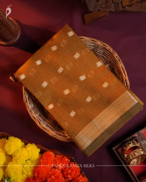 Mustard gold silk cotton saree with golden zari buttas and sage grey pallu