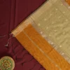 Mustard Gold Soft Silk Cotton Saree with Golden Zari Buttas Mustard gold silk cotton saree with golden zari buttas and sage grey pallu