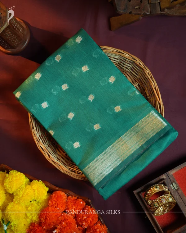 Peacock Blue Silk Cotton Saree with Golden Zari Buttas Peacock blue silk cotton saree with golden zari buttas and sage grey pallu