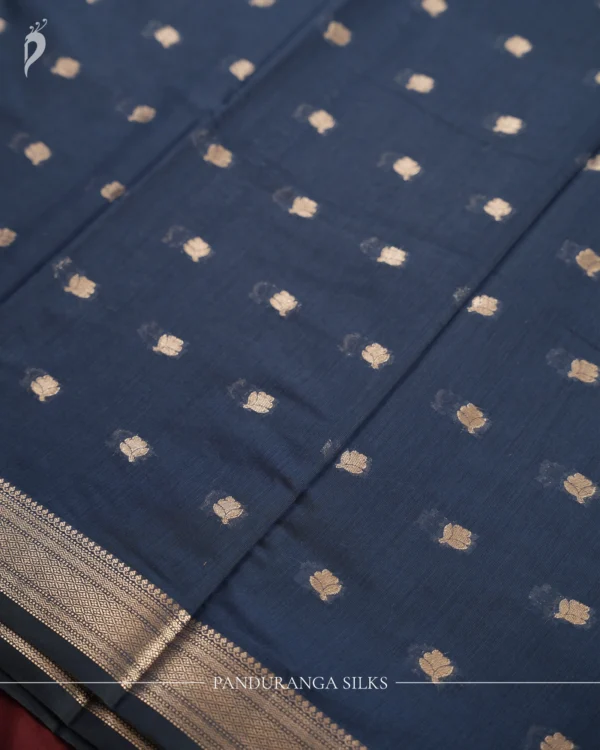 Navy Blue Soft Silk Cotton Saree with Golden Zari Buttas Navy blue silk cotton saree with golden zari buttas and sage grey pallu