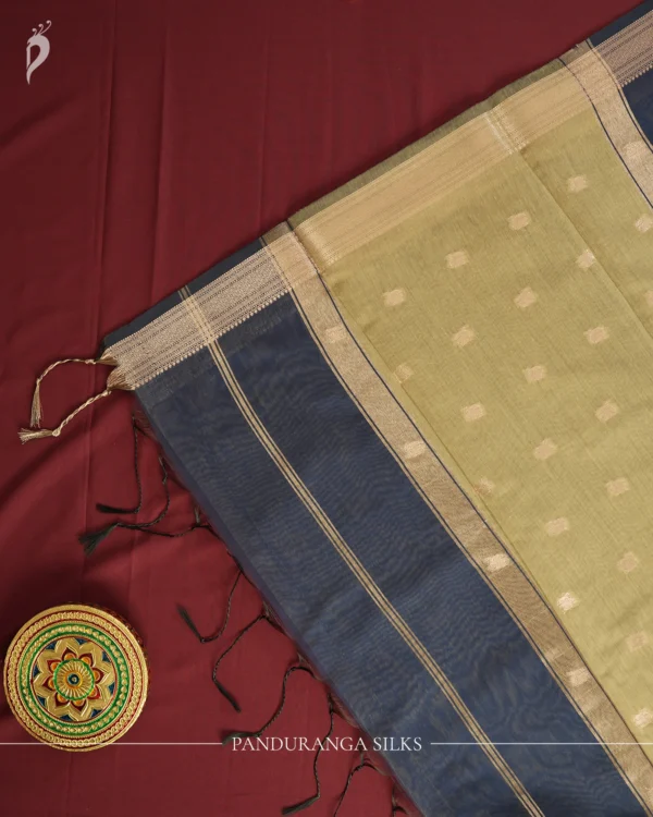 Navy Blue Soft Silk Cotton Saree with Golden Zari Buttas Navy blue silk cotton saree with golden zari buttas and sage grey pallu