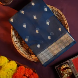 Navy blue silk cotton saree with golden zari buttas and sage grey pallu