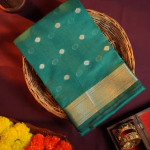 Peacock blue silk cotton saree with golden zari buttas and sage grey pallu and blouse