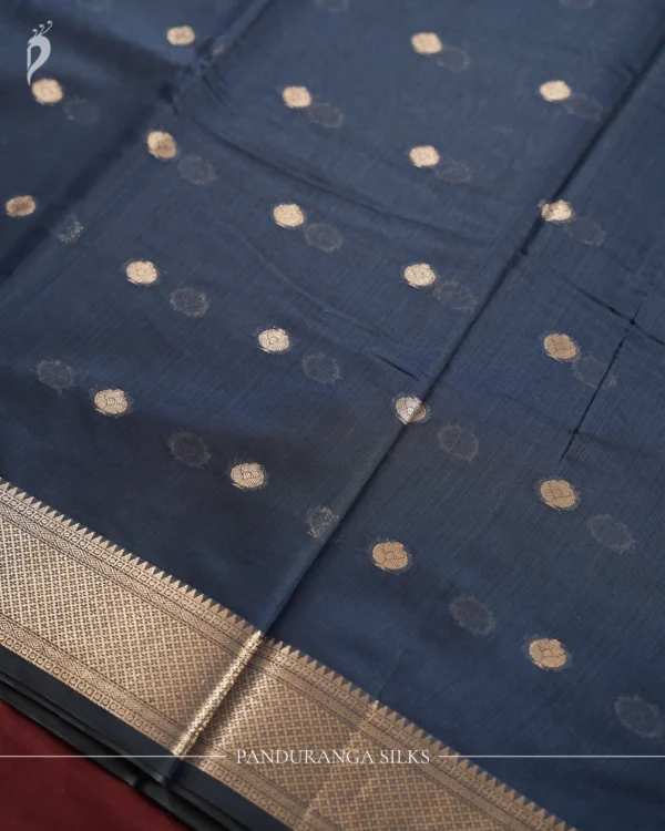 Navy Blue Soft Silk Cotton Saree with Beautiful Golden Zari Buttas Navy blue silk cotton saree with golden zari buttas and sage grey pallu and blouse