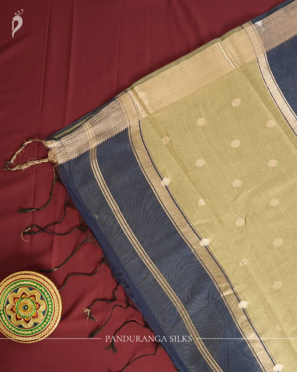 Navy Blue Soft Silk Cotton Saree with Beautiful Golden Zari Buttas Navy blue silk cotton saree with golden zari buttas and sage grey pallu and blouse