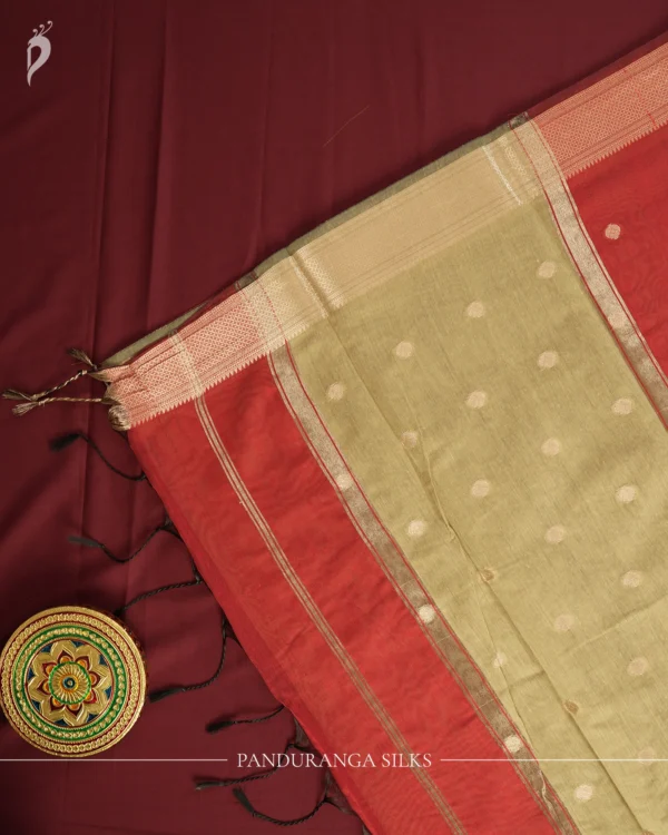 Maroon Soft Silk Cotton Saree with Beautiful Golden Zari Buttas Maroon silk cotton saree with golden zari buttas and sage grey pallu and blouse