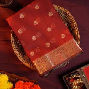 Red silk cotton saree with golden zari buttas and sage grey pallu and blouse